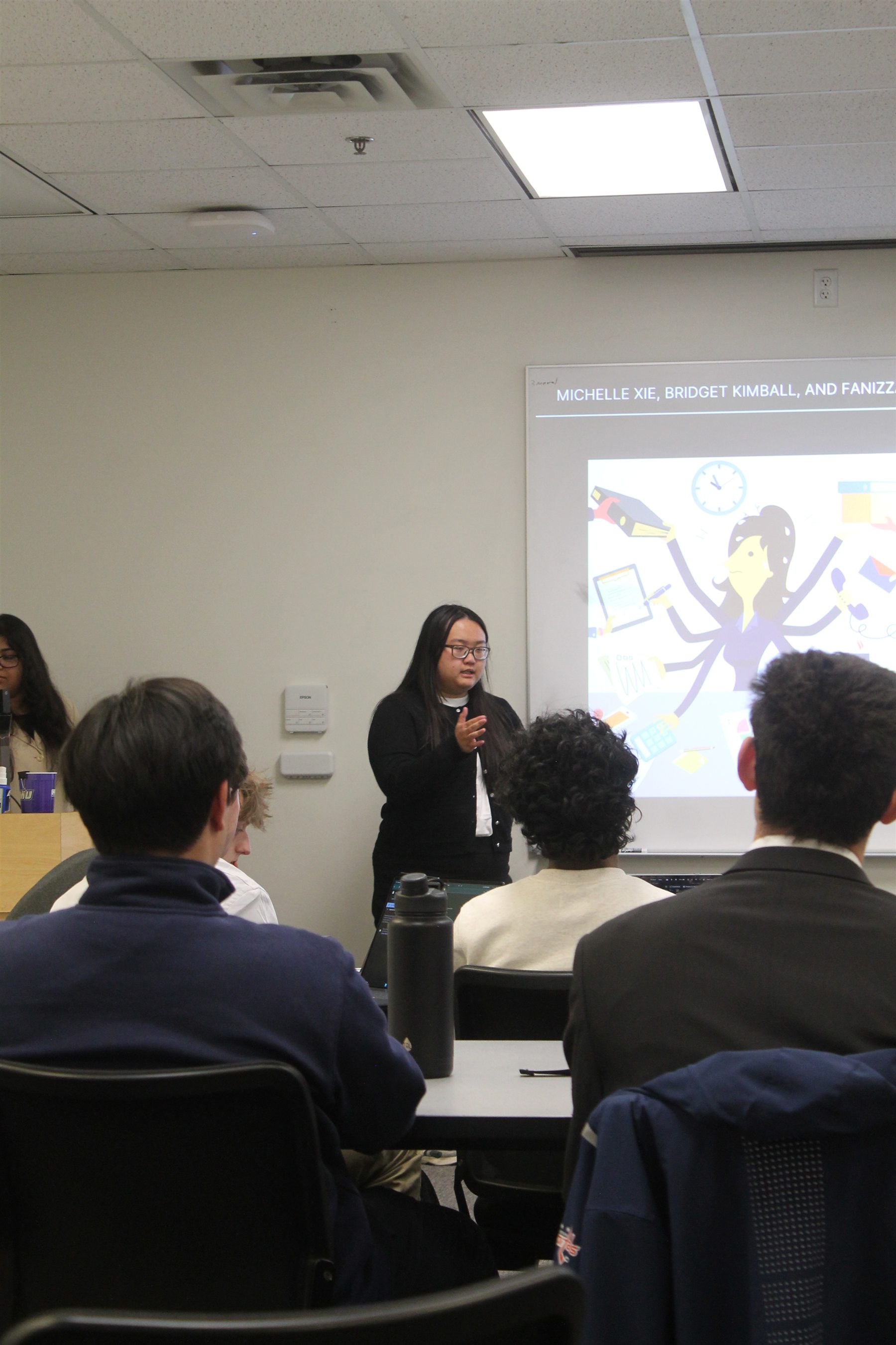 A student presenting to a classroom of peers